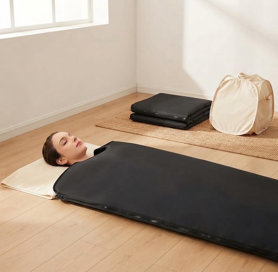 Infrared Sauna Blanket, Sleeveless Black set up in a home room